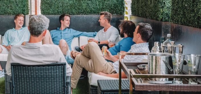 Group of men chilling while enjoying each others company