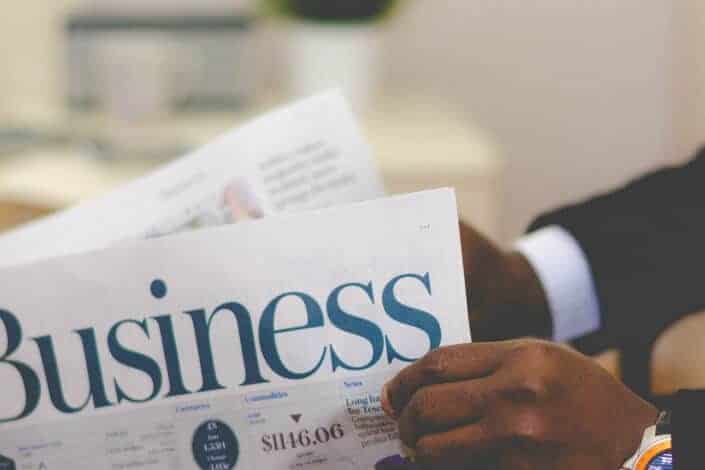 A man reading a business newspaper