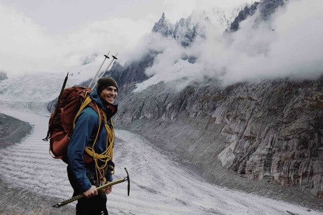 list of hobbies - man standing near mountain during winter