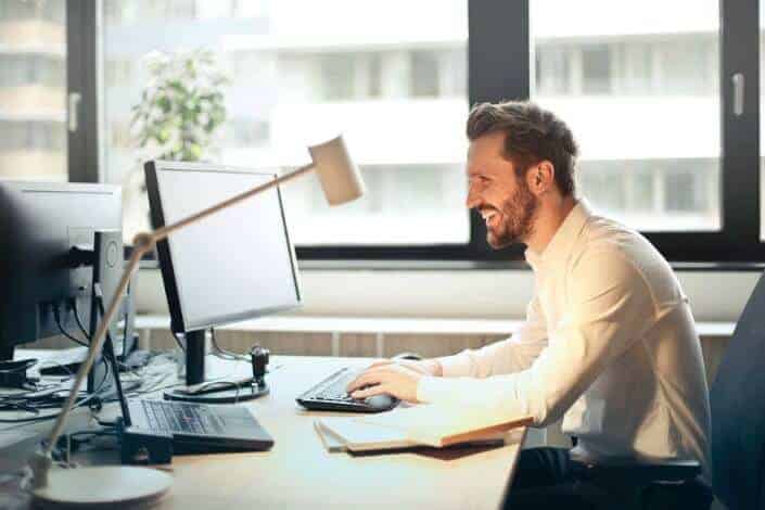 positive man working in his workplace