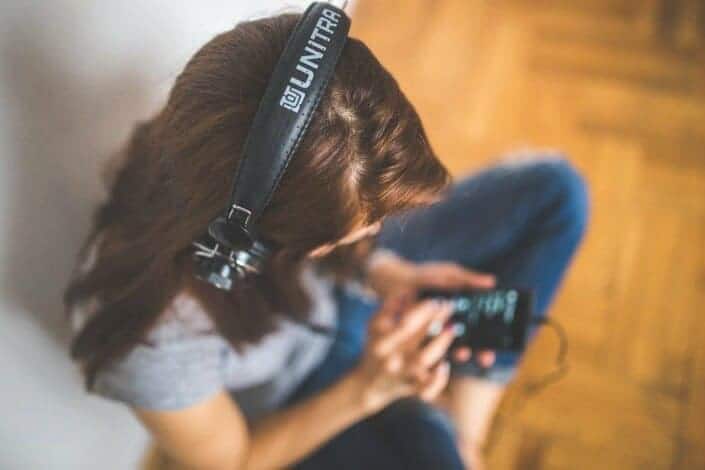 woman busy listening music on her phone