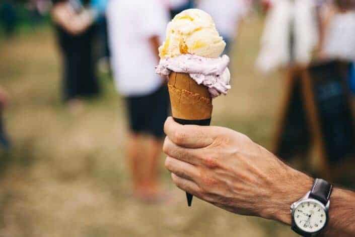 person holding an ice-cream with unique flavor