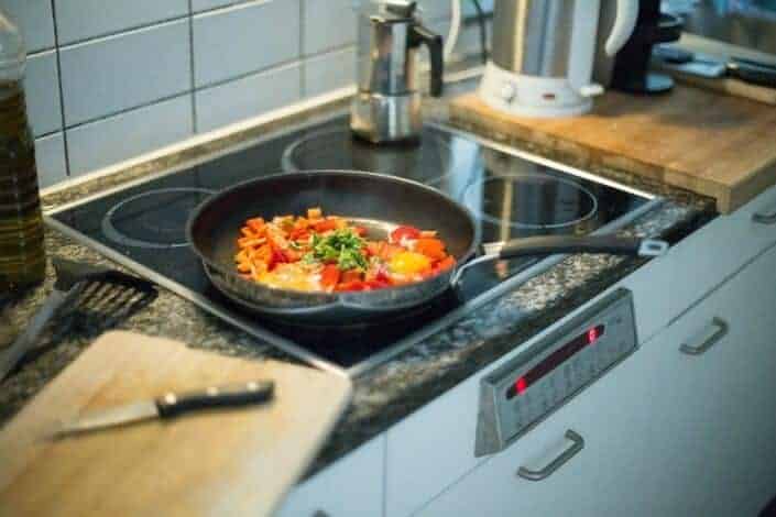 cooking vegetables in a frying pan