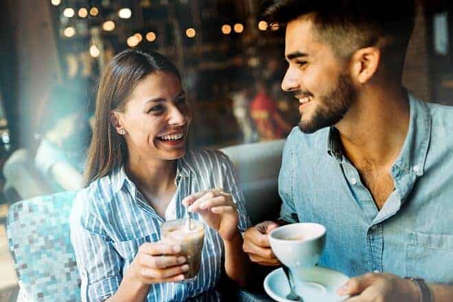 first date questions - Couple on date in coffee shop 