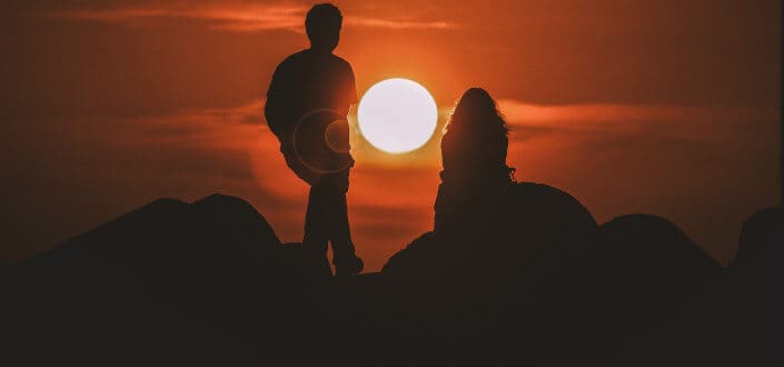 Couple enjoying the beautiful sunset together.