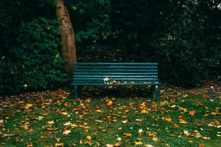 A blue green colored bench