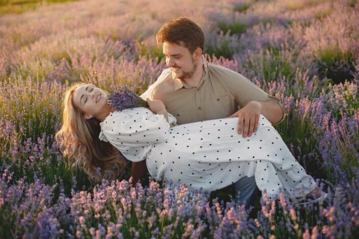 Man carrying her woman on a lavender field