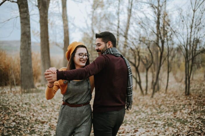 Young couple dancing in forest