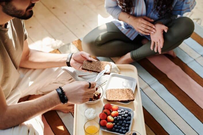 a-man-spreading-cream-on-bread-pexels