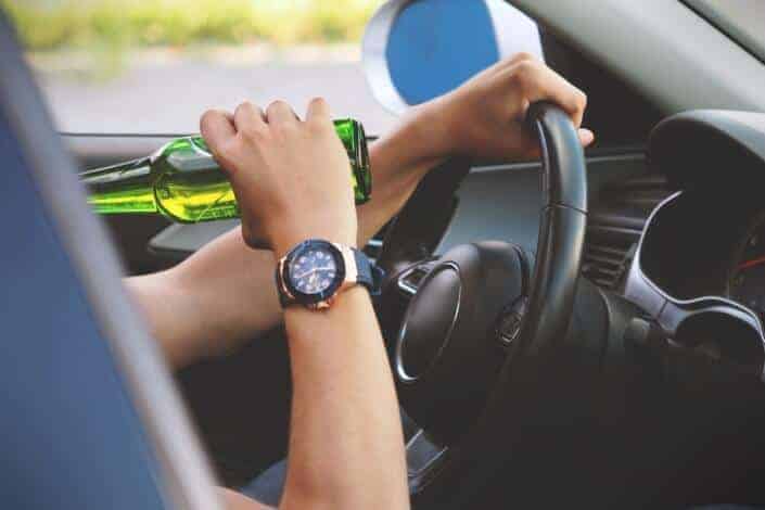 Man drinking while driving