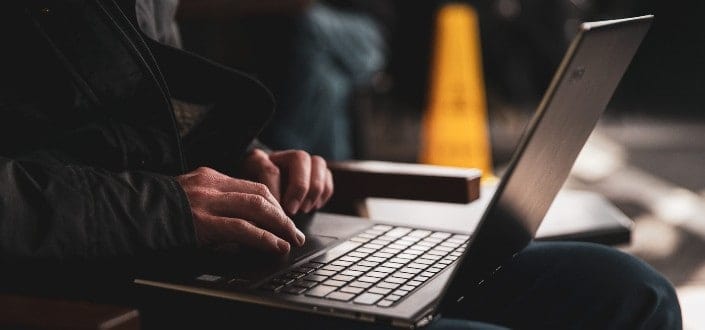 Man using laptop on his lap