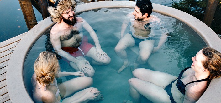 Friends enjoying a bath on a small pool