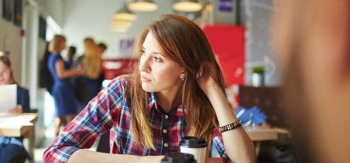 Serious looking lady staring over the window