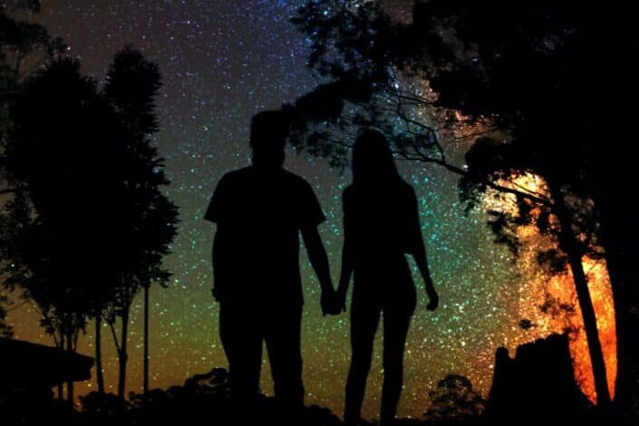 silhouette-of-man-and-woman-holding-hands-