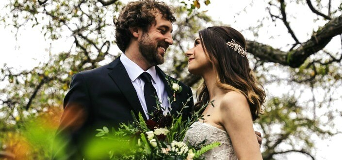 newlywed couple pose for photo