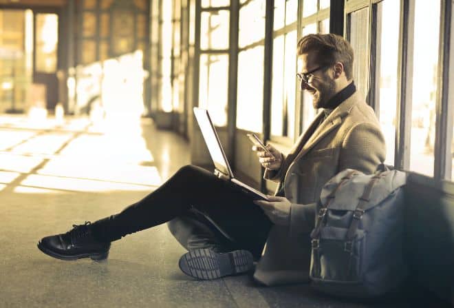 man texting on his phone - main