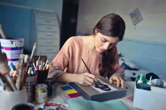 Young woman painting something