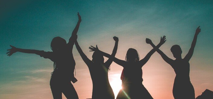 silhouette photo of women having fun under daylight