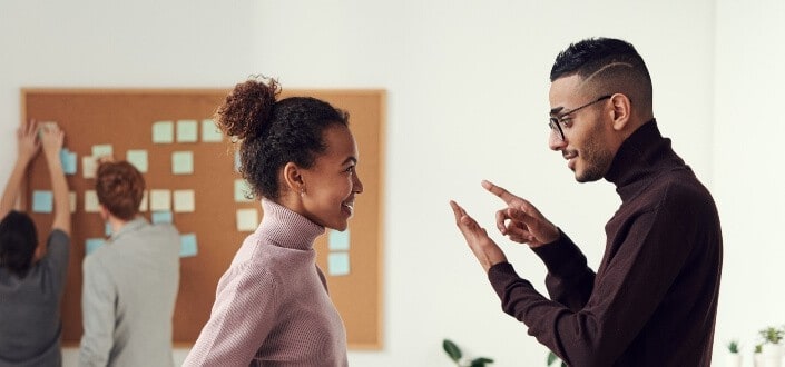 Guy and a girl having a fun conversation.