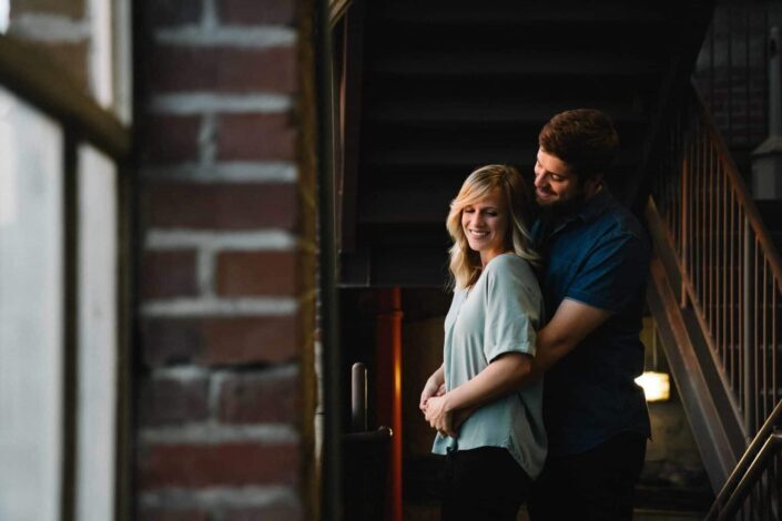 Man hugging his woman from behind