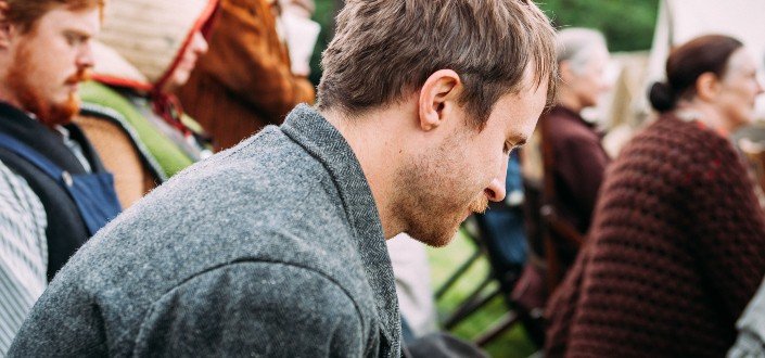 man sitting on chair near people sitting on chair