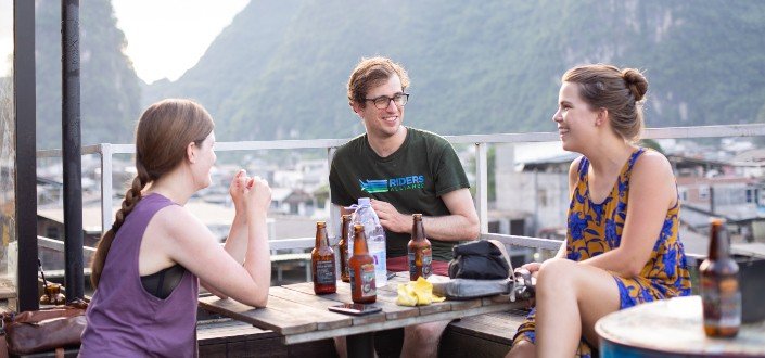 3 friends chat over beer