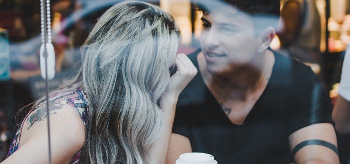 man and woman in cafe