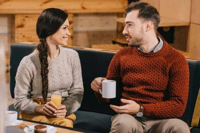 things to say to your crush - smiling friends chatting in cafe