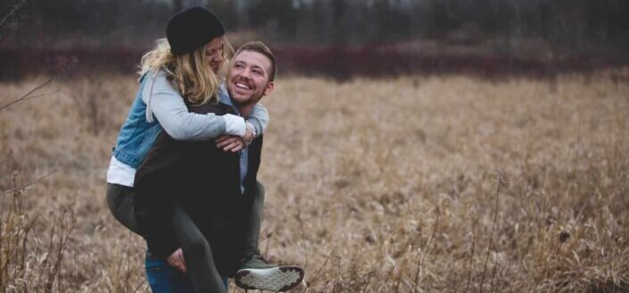 man carrying his girlfriend