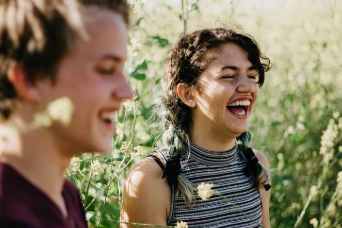 Guy and a girl laughing together.