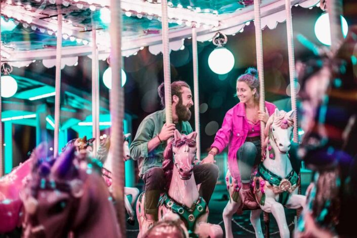 Couple enjoying the carousel together.