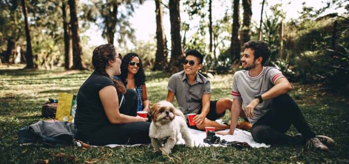 Friend playing a question game outdoors.