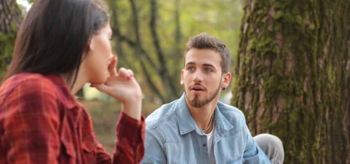 Man and Woman Talking in a Forest