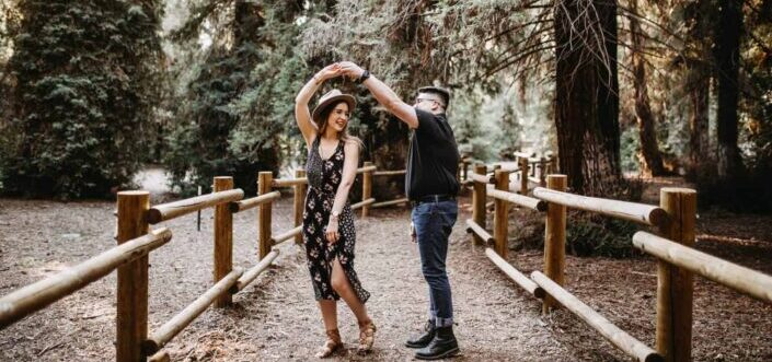 A Man and A Woman Dancing In The Middle Of The Forest