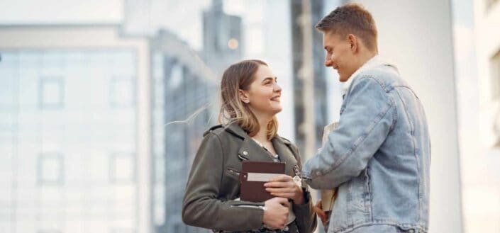 Couple talking to each other in middle of street