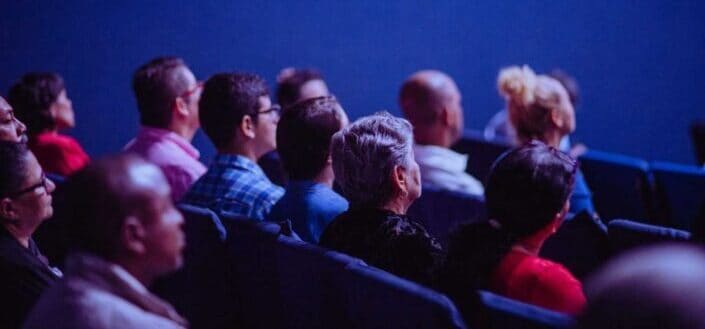 Group of people inside an auditorium