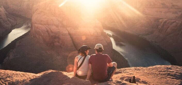 Couple sitting while overlooking a beautiful view