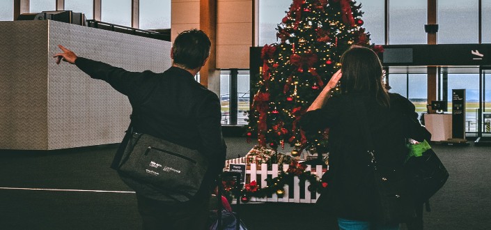 Man and Woman Staring at Christmas Tree