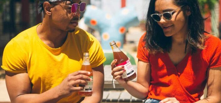 Man and woman having a drink outside