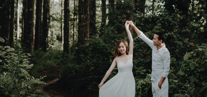 couple dancing in the middle of the forest