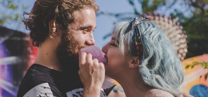 Couple biting a cotton candy