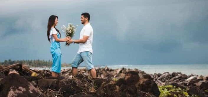 Man giving flowers to his girlfriend