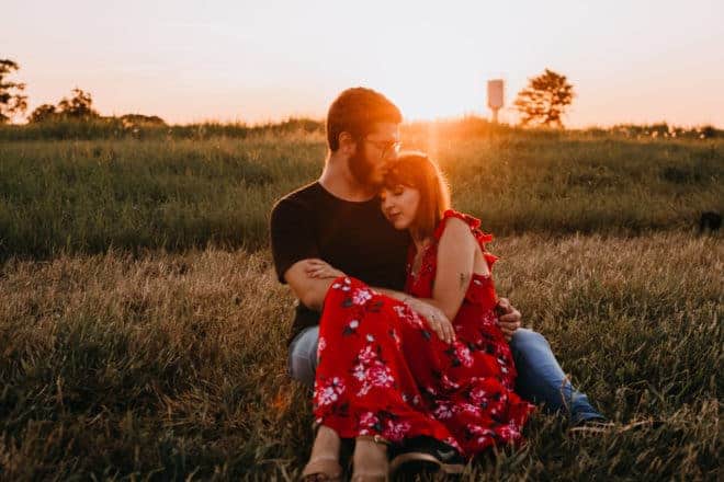 good question to ask your girlfriend - Couple sitting on the fields