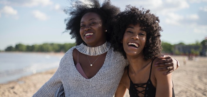 Two beautiful women smiling at camera