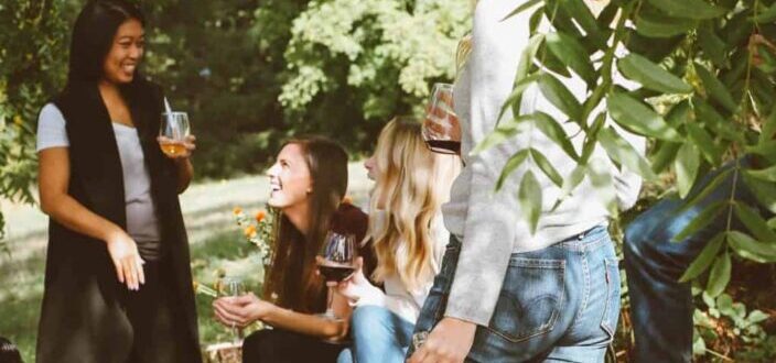 group of women in forest drinking