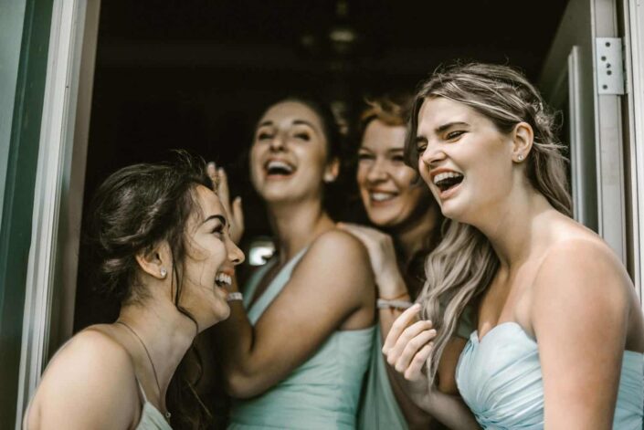 Girls wearing gown laughing together