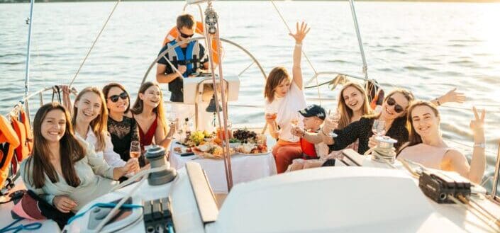 a-group-of-people-riding-a-yacht-while-having-a-party-pexels