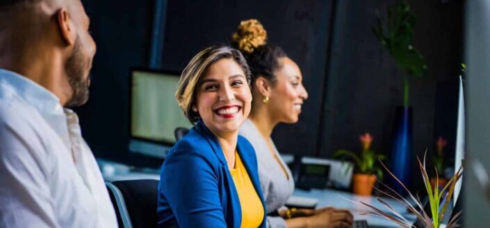 Woman Smiling at Her Officemates