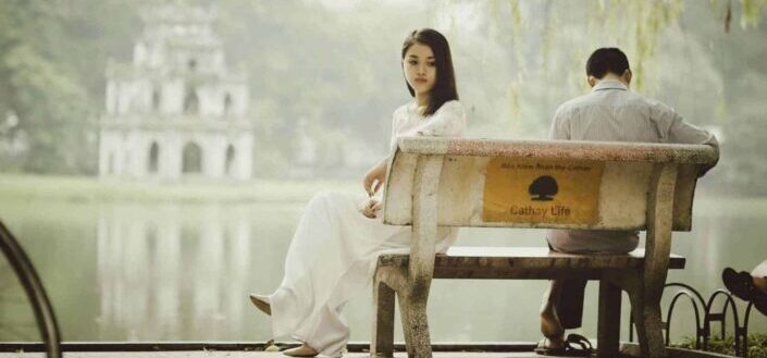 Woman Sitting on Bench Outdoors