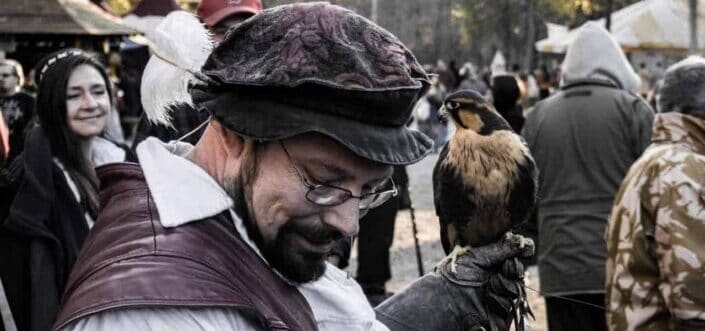 man holding a bird